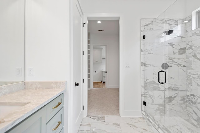 bathroom with visible vents, vanity, baseboards, marble finish floor, and a marble finish shower