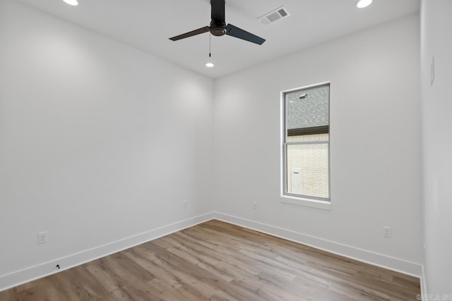 spare room with a ceiling fan, baseboards, recessed lighting, and wood finished floors