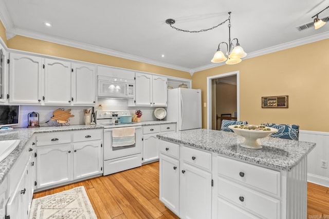 3 E Lake Dr, North Little Rock, AR 72116 - kitchen featuring ornamental molding, white appliances, white cabinetry, and a notable chandelier