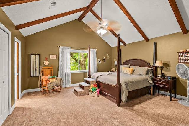 carpeted bedroom featuring visible vents, baseboards, ceiling fan, and vaulted ceiling with beams