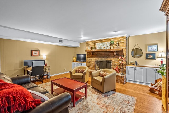 3 E Lake Dr, North Little Rock, AR 72116 - living area with a fireplace, visible vents, ornamental molding, and light wood-type flooring