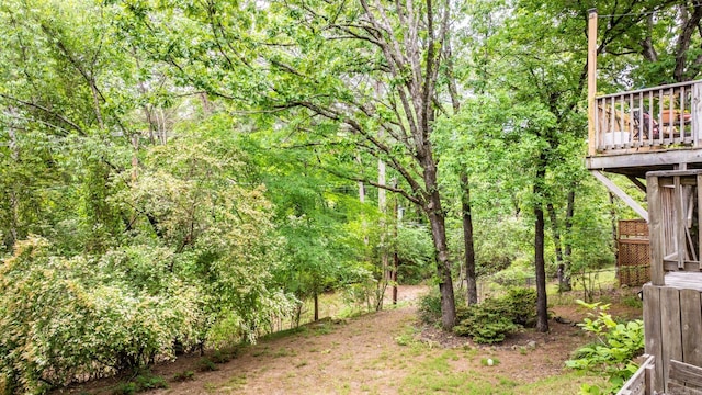 view of yard featuring a forest view