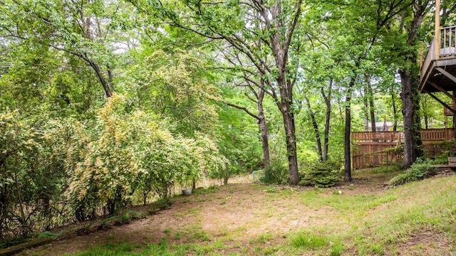 3 E Lake Dr, North Little Rock, AR 72116 - view of yard featuring a wooded view and a deck