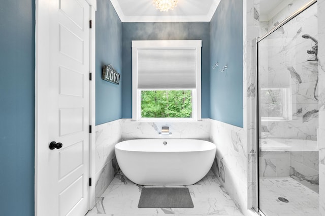 bathroom with a marble finish shower, a soaking tub, wainscoting, and marble finish floor