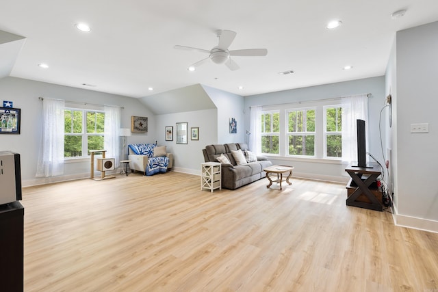 living area with light wood-style floors, a ceiling fan, baseboards, and recessed lighting