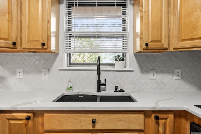 22 Colony Rd, Little Rock, AR 72227 - kitchen with light stone counters, a sink, and decorative backsplash