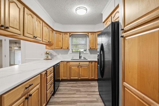 22 Colony Rd, Little Rock, AR 72227 - kitchen with a textured ceiling, a sink, light wood finished floors, backsplash, and black appliances
