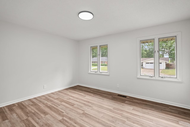 22 Colony Rd, Little Rock, AR 72227 - unfurnished room featuring baseboards, visible vents, and light wood-style flooring