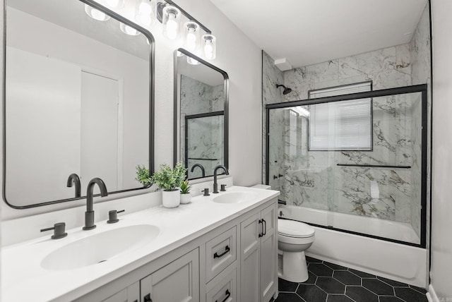 22 Colony Rd, Little Rock, AR 72227 - full bath with double vanity, toilet, combined bath / shower with glass door, and a sink