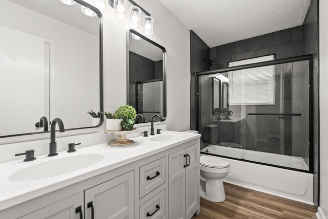 22 Colony Rd, Little Rock, AR 72227 - bathroom with a sink, double vanity, toilet, and shower / bath combination with glass door