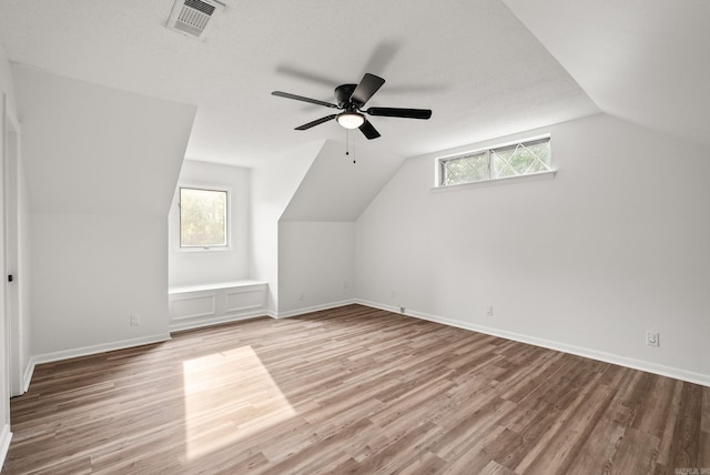 22 Colony Rd, Little Rock, AR 72227 - bonus room with visible vents, lofted ceiling, wood finished floors, baseboards, and a ceiling fan