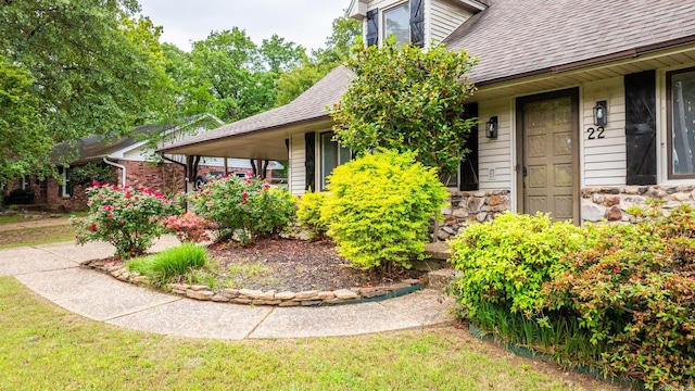 22 Colony Rd, Little Rock, AR 72227 - entrance to property with a porch, a shingled roof, and stone siding