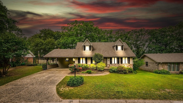 22 Colony Rd, Little Rock, AR 72227 - view of front of home with fence, covered porch, a front yard, concrete driveway, and a carport