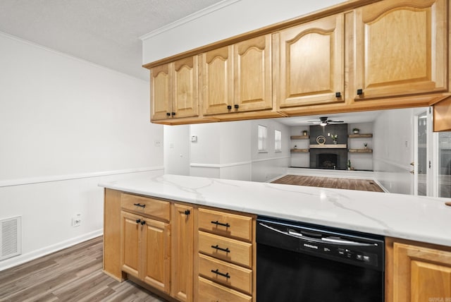 22 Colony Rd, Little Rock, AR 72227 - kitchen with a ceiling fan, visible vents, light stone counters, light wood-style floors, and black dishwasher
