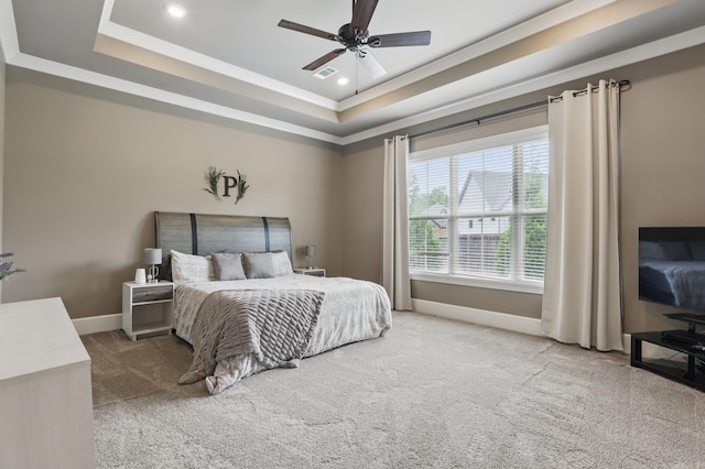 carpeted bedroom featuring a ceiling fan, visible vents, a raised ceiling, baseboards, and recessed lighting
