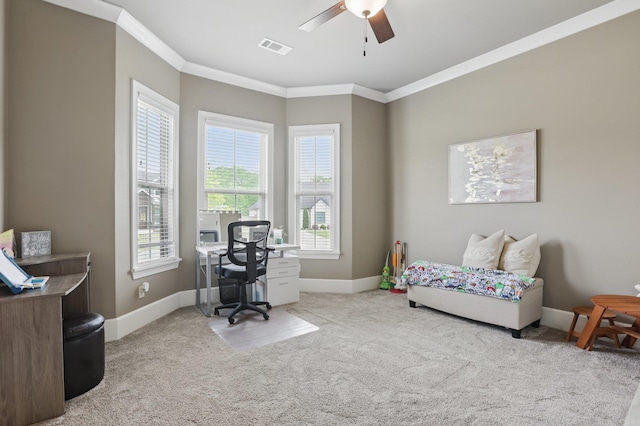 carpeted office featuring crown molding, baseboards, ceiling fan, and visible vents