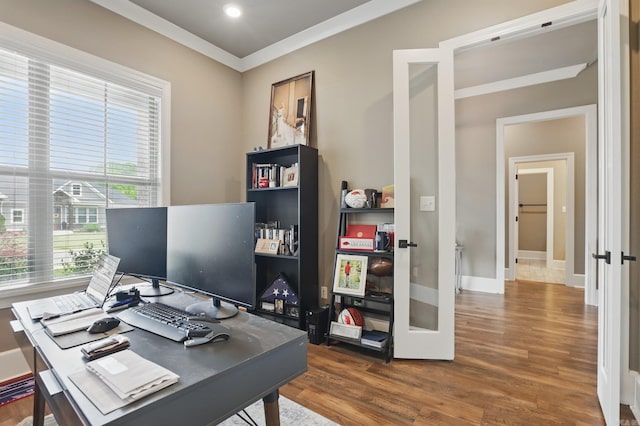 office area with crown molding, french doors, and wood finished floors