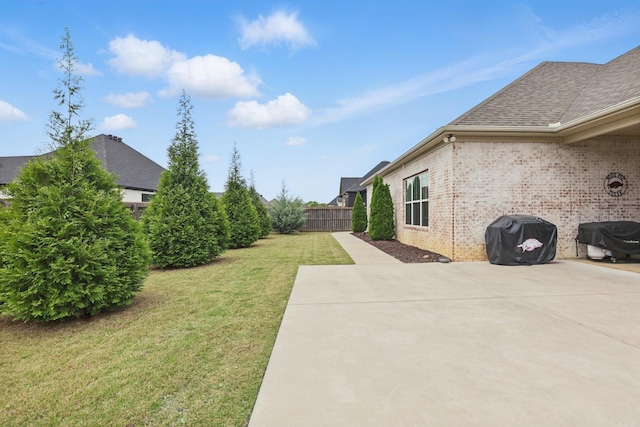view of yard featuring a patio area and fence