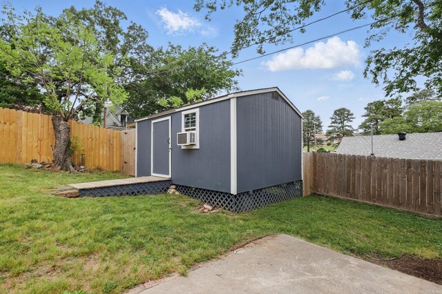 view of shed with a fenced backyard