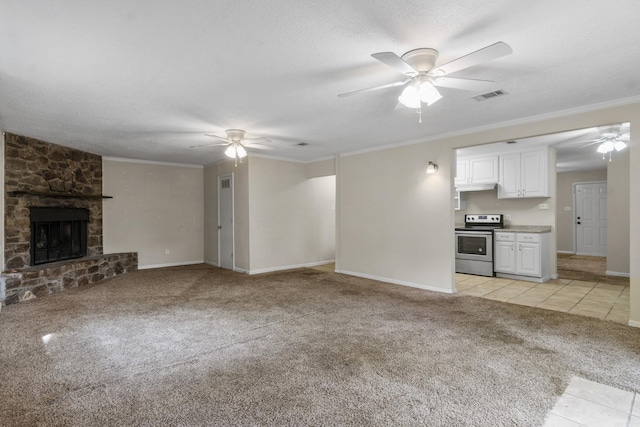 unfurnished living room with crown molding, ceiling fan, visible vents, and light colored carpet