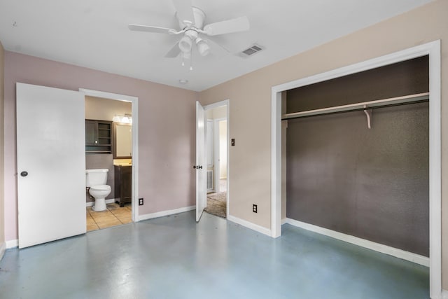 unfurnished bedroom with visible vents, baseboards, a closet, concrete floors, and connected bathroom