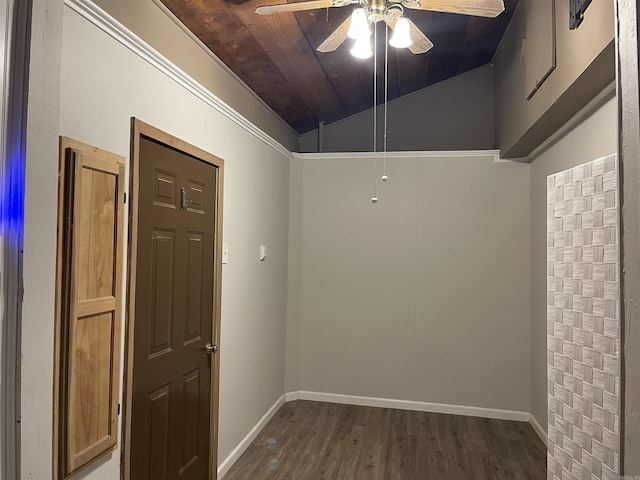 spare room featuring wood finished floors, baseboards, ceiling fan, wooden ceiling, and vaulted ceiling