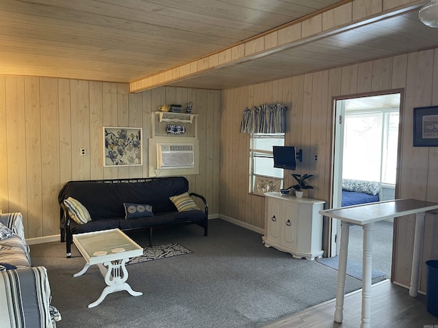 living room featuring wood ceiling and wood walls