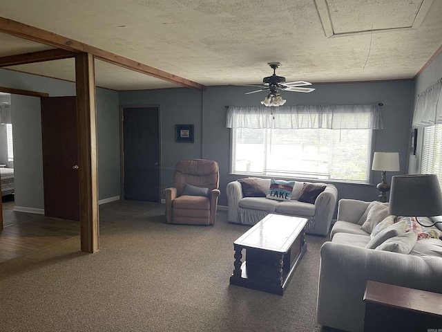 living area featuring carpet floors, ceiling fan, and baseboards