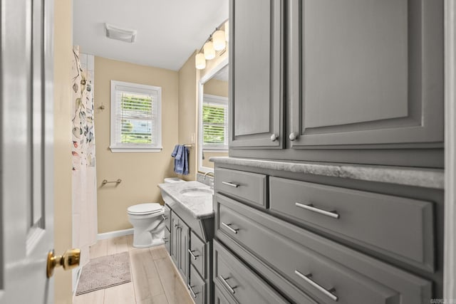 416 Ivory Dr, Little Rock, AR 72205 - bathroom with vanity, baseboards, and toilet
