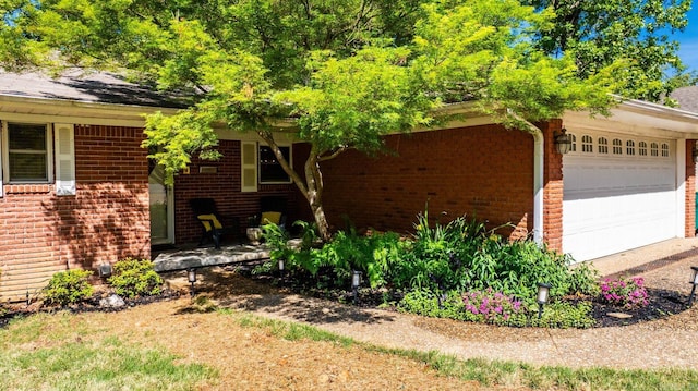 416 Ivory Dr, Little Rock, AR 72205 - view of side of home featuring covered porch, brick siding, and an attached garage