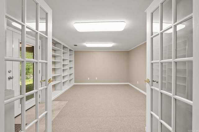 416 Ivory Dr, Little Rock, AR 72205 - spare room featuring french doors, crown molding, baseboards, and carpet floors