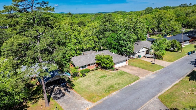416 Ivory Dr, Little Rock, AR 72205 - birds eye view of property featuring a wooded view