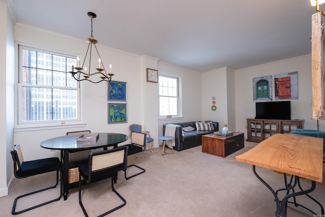 523 S Louisiana St Unit 10A, Little Rock, AR 72201 - carpeted dining area featuring an inviting chandelier and ornamental molding