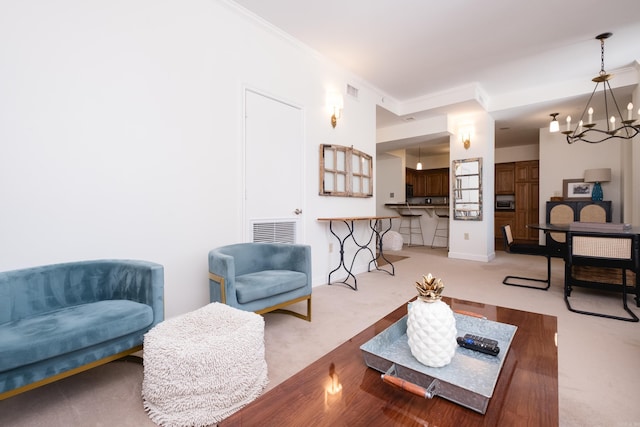 523 S Louisiana St Unit 10A, Little Rock, AR 72201 - living room featuring carpet flooring, an inviting chandelier, ornamental molding, and visible vents