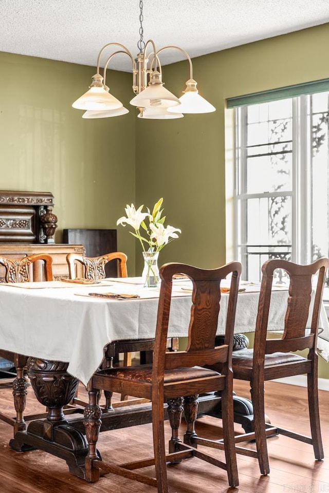 7510 Briarwood Dr, Little Rock, AR 72205 - dining room with a textured ceiling and wood finished floors