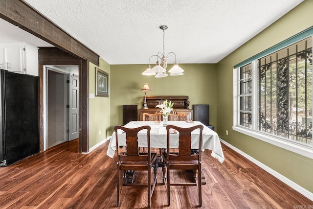 7510 Briarwood Dr, Little Rock, AR 72205 - dining room with baseboards, a textured ceiling, and dark wood-style floors