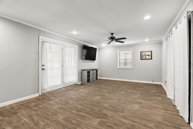 7510 Briarwood Dr, Little Rock, AR 72205 - unfurnished living room featuring baseboards, ornamental molding, a ceiling fan, and wood finished floors