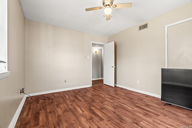 7510 Briarwood Dr, Little Rock, AR 72205 - unfurnished bedroom featuring baseboards, a ceiling fan, wood finished floors, and visible vents