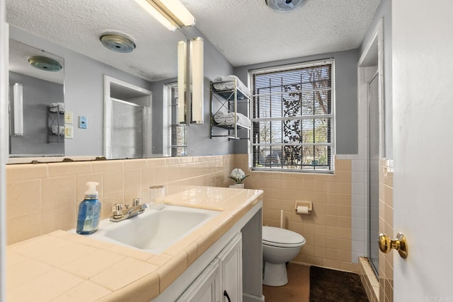 7510 Briarwood Dr, Little Rock, AR 72205 - full bathroom with toilet, tile walls, a shower stall, and vanity