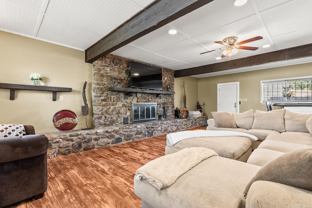 7510 Briarwood Dr, Little Rock, AR 72205 - living area with wood finished floors, beamed ceiling, a stone fireplace, ceiling fan, and recessed lighting