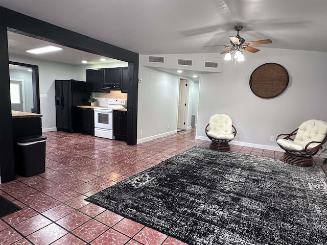 living room featuring tile patterned floors, ceiling fan, and visible vents