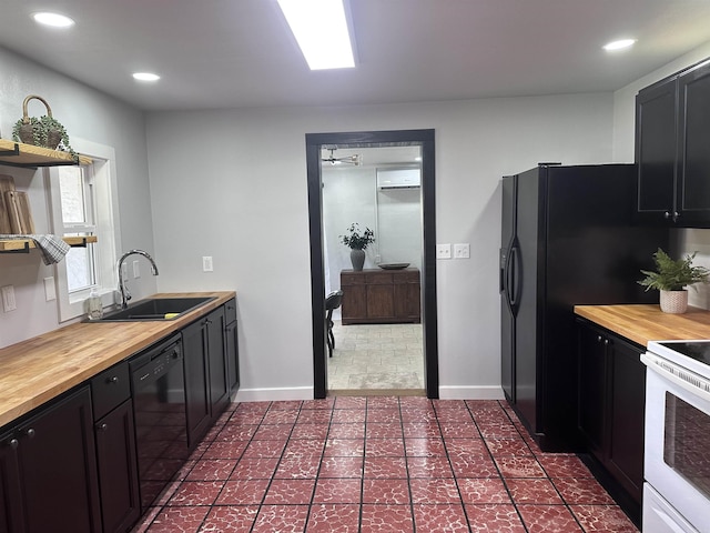 kitchen featuring a sink, black dishwasher, electric range, and butcher block countertops