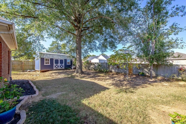 20 N Gettysburg, Cabot, AR 72023 - view of yard featuring a fenced backyard, a storage unit, and an outbuilding
