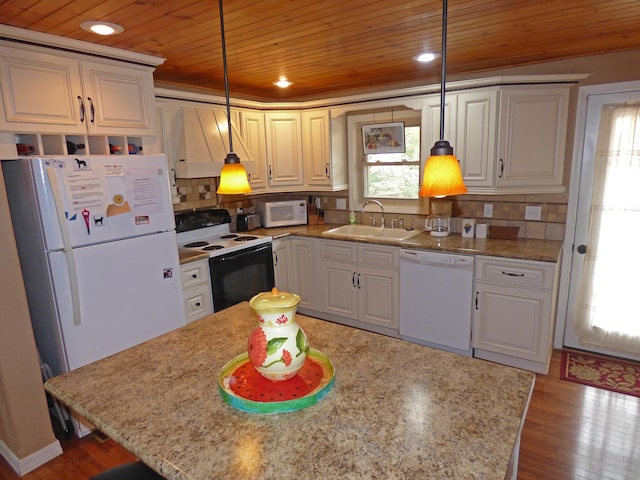 kitchen with decorative backsplash, wood finished floors, white appliances, wood ceiling, and a sink