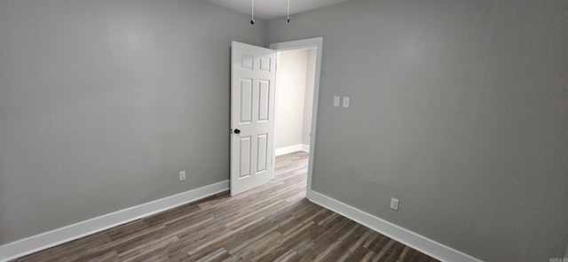 1620 S Harrison St, Little Rock, AR 72204 - unfurnished room with dark wood-style floors and baseboards