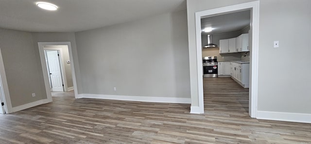 1620 S Harrison St, Little Rock, AR 72204 - spare room featuring baseboards, wood finished floors, and a sink
