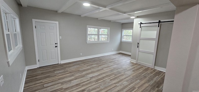1620 S Harrison St, Little Rock, AR 72204 - foyer entrance with wood finished floors, a barn door, beamed ceiling, baseboards, and coffered ceiling