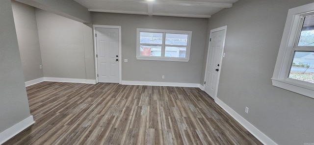 1620 S Harrison St, Little Rock, AR 72204 - unfurnished dining area with wood finished floors, baseboards, and beamed ceiling