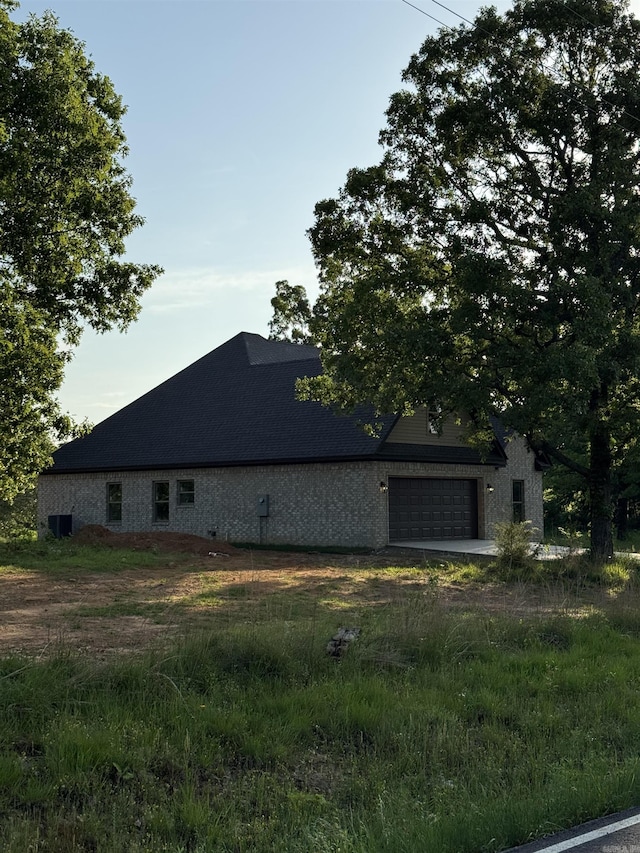 view of side of property with a garage