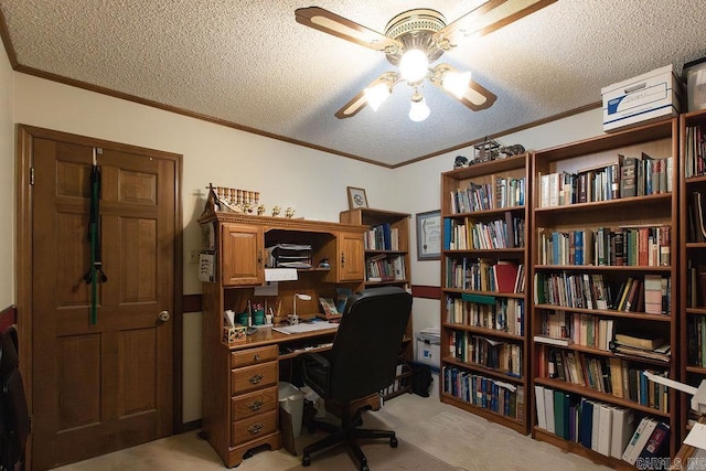 home office with crown molding, a ceiling fan, a textured ceiling, and light carpet
